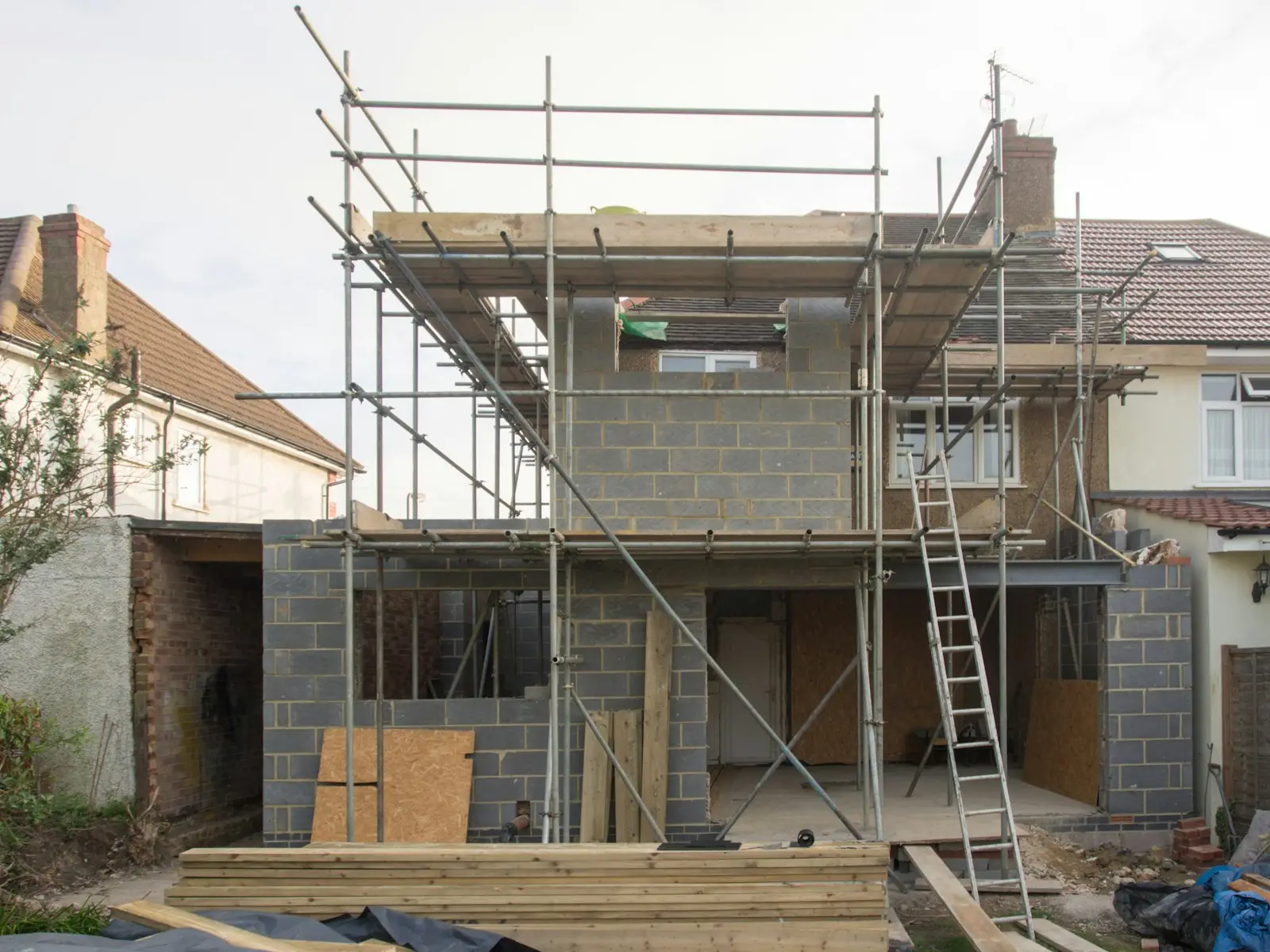 A house extension under construction with scaffolding
